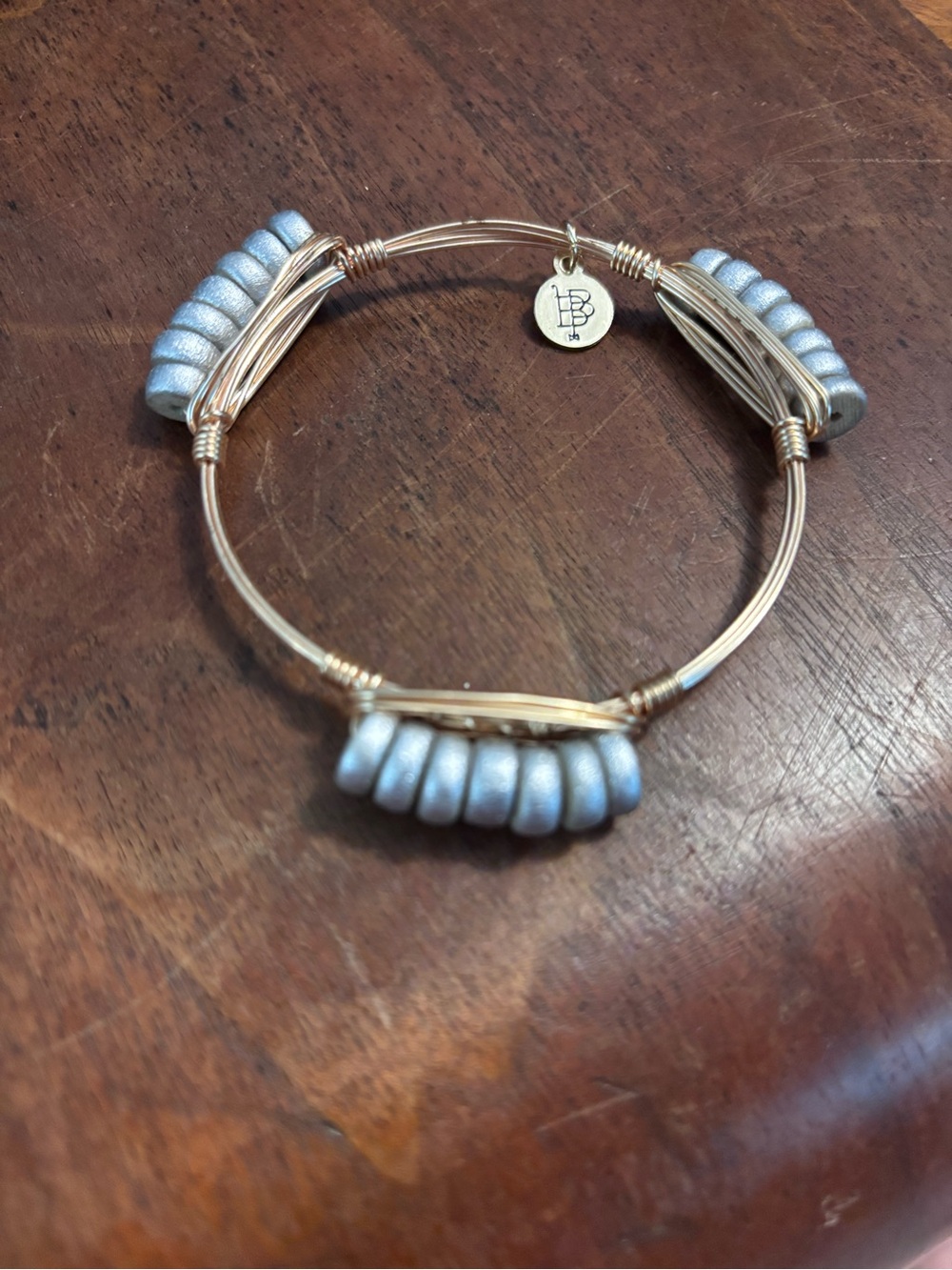 Bourbon and bowties. Gold Wire Bangle Bracelet with Silver Bead Accents